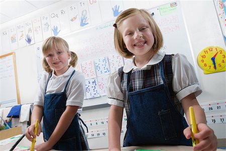 Elementary Students Painting During Art Class Stock Photo - Premium Royalty-Free, Code: 693-06020695