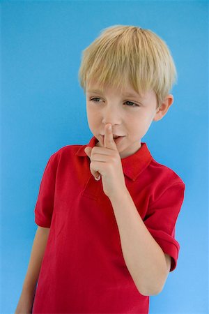 shhh - Boy with Finger on Lips Stock Photo - Premium Royalty-Free, Code: 693-06020801