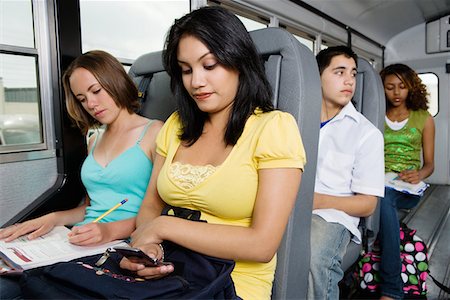 Teenagers Riding School Bus Stock Photo - Premium Royalty-Free, Code: 693-06020828