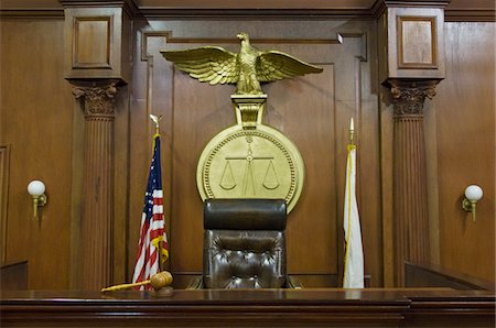 Legal scales behind judges chair in court Stock Photo - Premium Royalty-Free, Code: 693-06020925