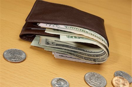 paid - Wallet Full of Money Stock Photo - Premium Royalty-Free, Code: 693-06021328