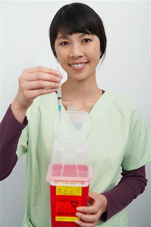 female nurse inject woman - Doctor holding hyperdermic needles in hospital,portrait Stock Photo - Premium Royalty-Free, Code: 693-06021429