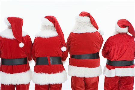 Group of men dressed as Santa Claus, rear view Stock Photo - Premium Royalty-Free, Code: 693-06021805