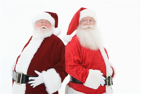 simsearch:693-06435898,k - Two men dressed as Santa Claus Stock Photo - Premium Royalty-Free, Code: 693-06021800