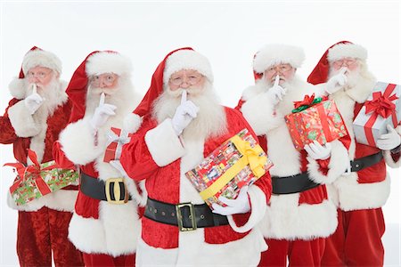 simsearch:693-06435898,k - Group of men dressed as Santa Claus holding gifts Stock Photo - Premium Royalty-Free, Code: 693-06021813