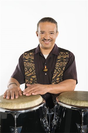 percussion instrument - Hispanic bongo drum player Stock Photo - Premium Royalty-Free, Code: 693-06021833