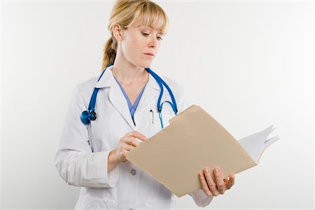 Doctor with medical file Stock Photo - Premium Royalty-Free, Code: 693-06021984