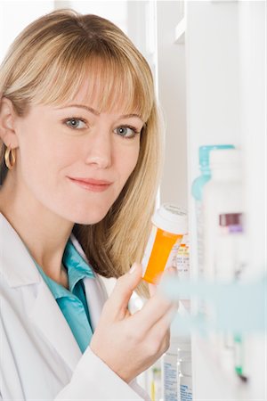 prescribe - Female pharmactist working in pharmacy Stock Photo - Premium Royalty-Free, Code: 693-06022008