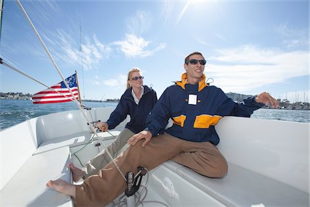 Young couple relax on deck of sailing boat Stock Photo - Premium Royalty-Free, Code: 693-06022159