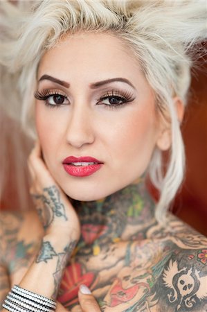 female hand - Portrait of blond woman with tattoos Stock Photo - Premium Royalty-Free, Code: 693-06120717