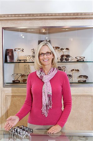 saleswoman - Portrait of a senior optometrist wearing glasses in store Stock Photo - Premium Royalty-Free, Code: 693-06121118