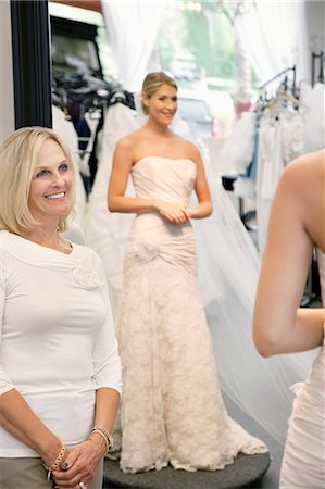 simsearch:693-06325147,k - Happy mother admiring daughter dressed in a wedding gown Stock Photo - Premium Royalty-Free, Code: 693-06324063