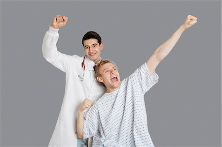 doctor and patient, portrait - Indian doctor with an enthusiastic patient cheering up Stock Photo - Premium Royalty-Free, Code: 693-06324317