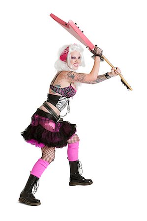 simsearch:693-06325015,k - Young punk woman about to wreck guitar over white background Stock Photo - Premium Royalty-Free, Code: 693-06324393