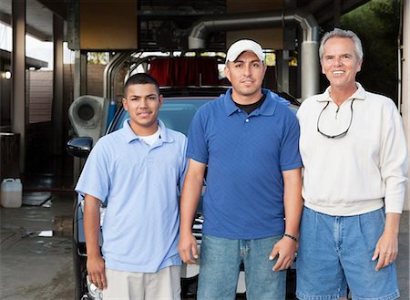 Portrait of owner with employee in car wash Stock Photo - Premium Royalty-Free, Code: 693-06324583