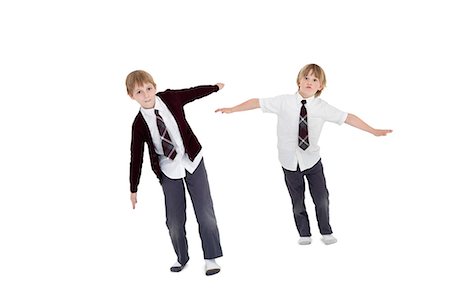 silueta (fotografía) - Boys with arms outstretched over white background Foto de stock - Sin royalties Premium, Código: 693-06324778