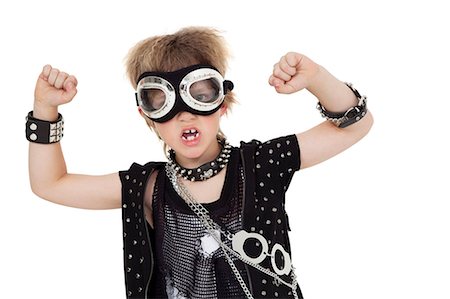 person on white costume - Portrait of punk kid wearing pilot goggles with raised fist over white background Stock Photo - Premium Royalty-Free, Code: 693-06324811