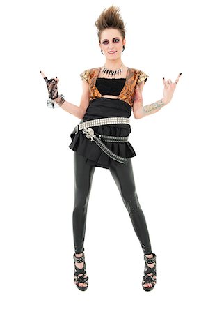 rocker - Portrait of punk woman gesturing rock sign over white background Stock Photo - Premium Royalty-Free, Code: 693-06324990