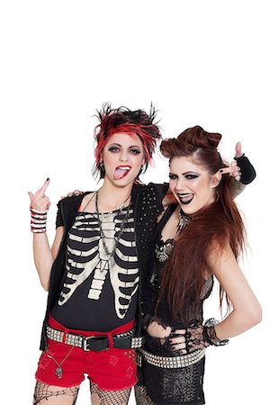 Arrogant punk females showing middle finger over white background Foto de stock - Sin royalties Premium, Código: 693-06325012