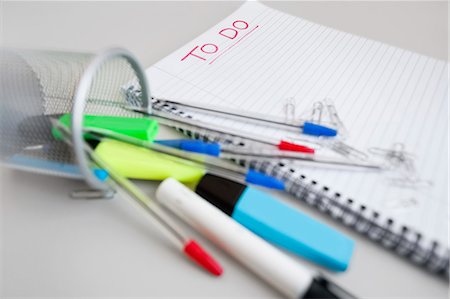 pen (writing instrument) - Close-up view of spiral notebook with to-do list and office supplies Stock Photo - Premium Royalty-Free, Code: 693-06325161