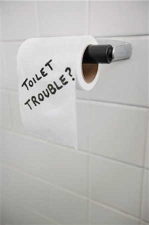 simsearch:700-00948651,k - Close-up of text written on tissue paper in bathroom depicting toilet problems Stock Photo - Premium Royalty-Free, Code: 693-06325179