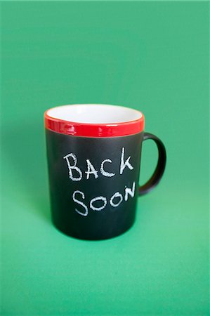 Coffee mug with text over colored background Stock Photo - Premium Royalty-Free, Code: 693-06325257