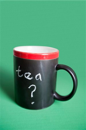 question mark - Close-up of coffee mug with text over colored background Stock Photo - Premium Royalty-Free, Code: 693-06325267