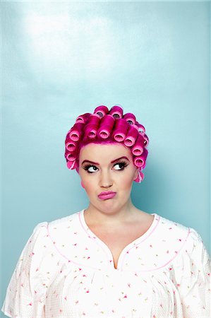 simsearch:693-06323962,k - Young woman with curlers on pink hair over colored background Stock Photo - Premium Royalty-Free, Code: 693-06323939