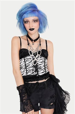 simsearch:693-06379584,k - Portrait of young female punk with dyed hair over gray background Stock Photo - Premium Royalty-Free, Code: 693-06378966