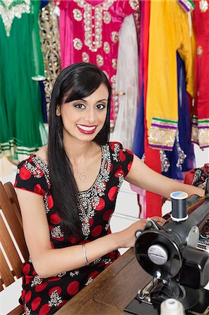 seamstress - Portrait of an Indian female dressmaker using sewing machine Stock Photo - Premium Royalty-Free, Code: 693-06379287