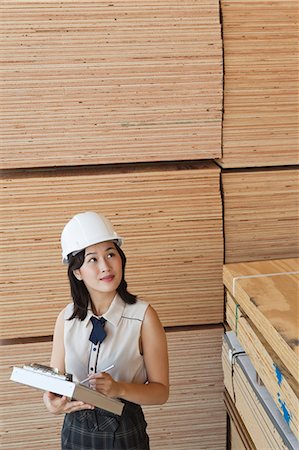 simsearch:693-06379747,k - Young female industrial worker inspecting wooden planks Stock Photo - Premium Royalty-Free, Code: 693-06379667