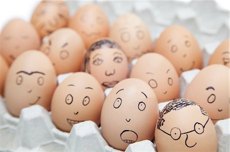 egg box - Various facial expressions painted on brown eggs in egg carton Stock Photo - Premium Royalty-Free, Code: 693-06379762