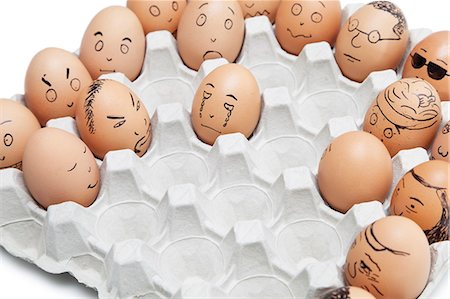 egg box - Variety of facial expressions painted on brown eggs arranged in carton Stock Photo - Premium Royalty-Free, Code: 693-06379763