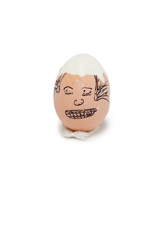 eggs white background - Anthropomorphic broken brown egg over white background Stock Photo - Premium Royalty-Free, Code: 693-06379779