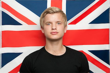 symbol for intelligence - Portrait of young man against British flag Stock Photo - Premium Royalty-Free, Code: 693-06379929