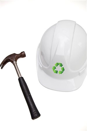 sign and symbols - Hammer and hard with recycling symbol against white background Stock Photo - Premium Royalty-Free, Code: 693-06403369