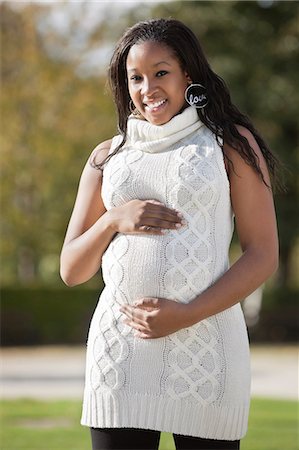 portrait of pregnant woman - Portrait of happy young pregnant woman in park Stock Photo - Premium Royalty-Free, Code: 693-06435863