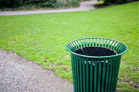 dustbin with waste material - Trash can in a park Stock Photo - Premium Royalty-Free, Code: 693-06667842
