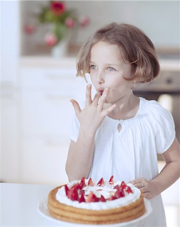 single strawberry - Young girl with cake and strawberries Stock Photo - Premium Royalty-Free, Code: 693-06967483