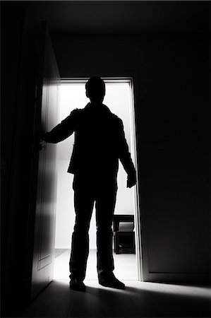 person in room - Full-length of thief entering into house Stock Photo - Premium Royalty-Free, Code: 693-07444429