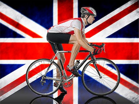 Male Cyclist cycling in front of Union Jack Flag Stock Photo - Premium Royalty-Free, Code: 693-07444550