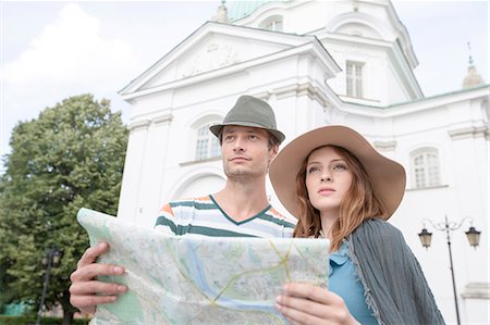 Tourist couple holding map outside St. Casimir Church, Warsaw, Poland Stock Photo - Premium Royalty-Free, Code: 693-07542199
