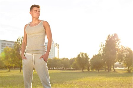 simsearch:693-07672615,k - Confident jogger standing in park Stock Photo - Premium Royalty-Free, Code: 693-07672612