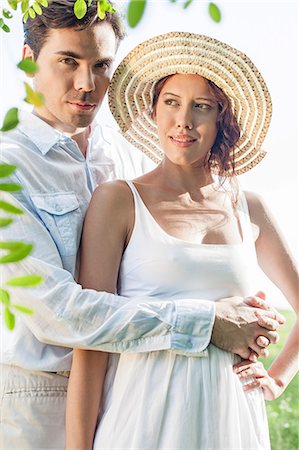 simsearch:693-07672684,k - Portrait of young man embracing woman in park Stock Photo - Premium Royalty-Free, Code: 693-07672775
