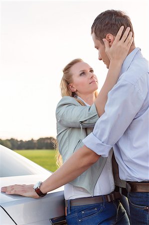 simsearch:693-07672684,k - Side view of romantic young couple by car at countryside Stock Photo - Premium Royalty-Free, Code: 693-07672876
