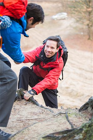 escursione - Hiker helping friend while trekking in forest Fotografie stock - Premium Royalty-Free, Codice: 693-07673001