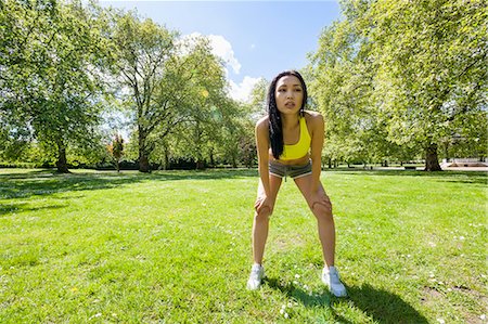 simsearch:693-07672615,k - Full length of tired fit woman taking a break while exercising in park Stock Photo - Premium Royalty-Free, Code: 693-07912090