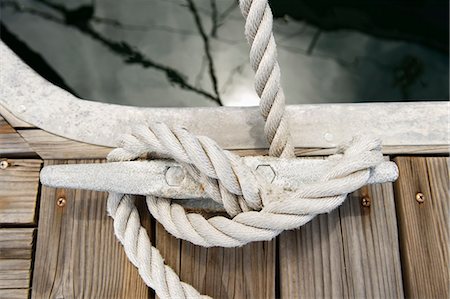 Rope tied to a jetty cleat Stock Photo - Premium Royalty-Free, Code: 693-07912184