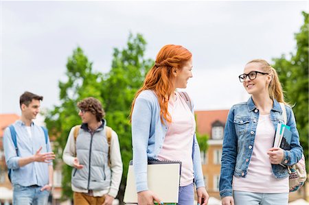 Group of college friends walking outdoors Stock Photo - Premium Royalty-Free, Code: 693-07912237
