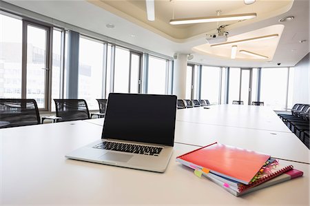 simsearch:614-08030536,k - Laptop and files on empty conference table in creative office Stock Photo - Premium Royalty-Free, Code: 693-07912509